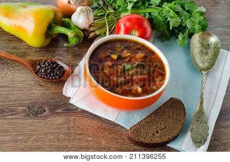 Bowl of traditional soup Borscht on table