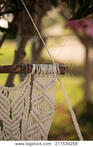 Closeup Of Macrame Art Hanging From The Piece Of Driftwood Shot With Shallow Depth Of Field