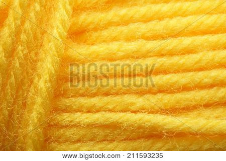 Wool yarns for knitting. Close-up Yellow color