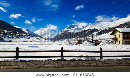 Winter Holiday In The Akps Mountains Under Blue Sky