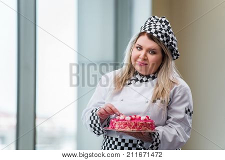Young woman chef preparing dessert cak