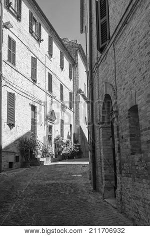 Montefano (Macerata Marches Italy) old buildings in the historic town. Black and white