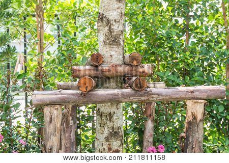 The wooden stakes are used to brace the trees that have been moved for stability.