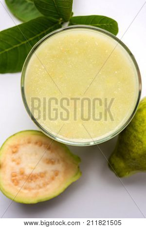 Guava  juice or Amrud drink or Smoothie with fresh Guava fruit, moody lighting selective focus