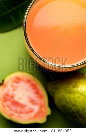 Guava  juice or Amrud drink or Smoothie with fresh Guava fruit, moody lighting selective focus