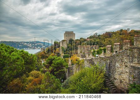 Walls of ancient Rumeli Hisari fortress and beautiful garden, Istanbul, Turkey in autumn time