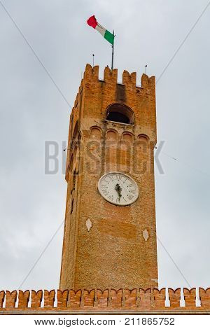 Treviso Civic Tower close up. Ancient civic tower of Treviso in Piazza dei Signori Treviso Veneto Italy. Piazza dei Signori Treviso.