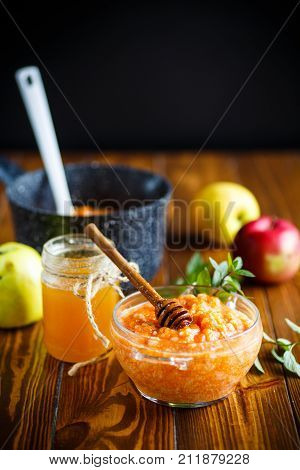 sweet pumpkin porridge with honey on a wooden table