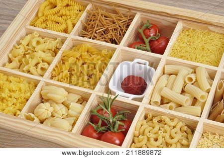 Various types of pasta with decoration on a table