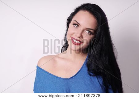 happy smiling attractive young woman wearing off-the-shoulder top. with copy space.