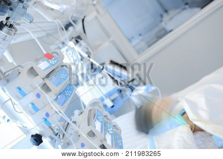 Small child receives treatment in the department of pediatric intensive care.