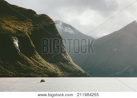 Mountains and fishing boat fjord sea wild Landscape in Norway scandinavian Travel