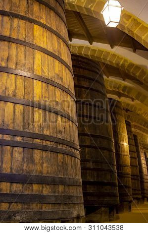 Vintage Wine Cellar With Old Oak Barrels, Production Of Fortified Dry Or Sweet Marsala Wine In Marsa