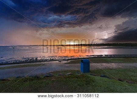 A Beautiful Sunset Storm By The River