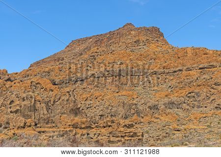 Colorful Cliffs Of Volcanic Rock In The Desert In Majove National Preserve In California