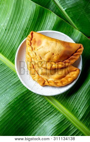 Easter Island Tuna Empanadas On Banana Palm Tree Leaves. Top View