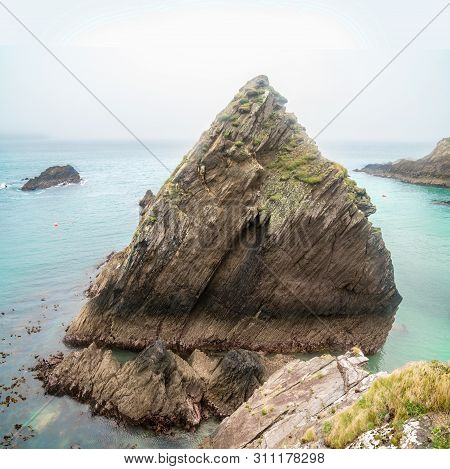 Rocks On Hazy Day In Nearby Dunmore Head, The Most Westerly Point Of Mainland Ireland. County Kerry.