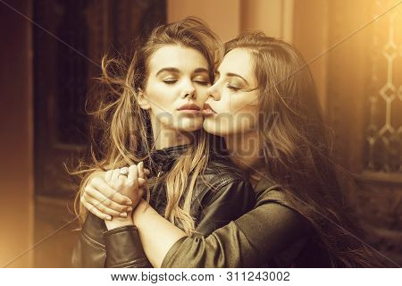 Lesbian. Two Pretty Women Or Cute Girls With Closed Eyes, Stylish Makeup And Beautiful, Long Hair Hu