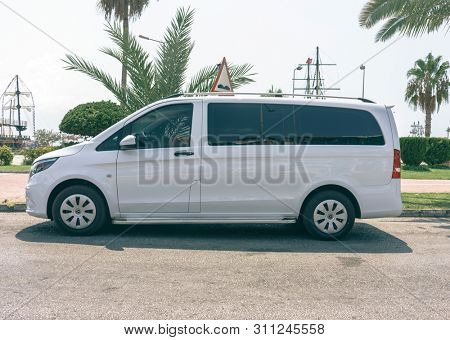 TURKEY, ALANIA -JULY 23, 2018 : Modern White Passenger Van on the Parking Lot