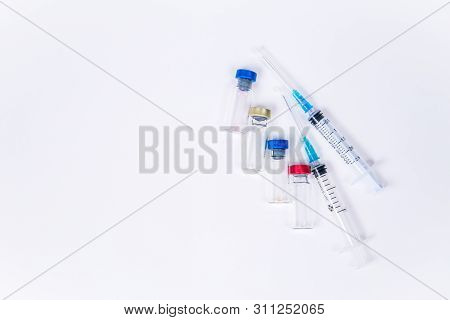 Veterinary And Medical Glass Vials And Two Syringes For Vaccination On A White Isolated Background. 