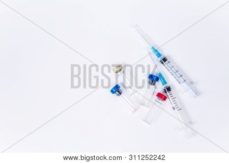 Veterinary And Medical Glass Vials And Two Syringes For Vaccination On A White Isolated Background. 