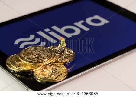 Morgantown, Wv - 14 July 2019: Golden Cybercurrency Coins On Top Of Tablet Computer As Concept For F