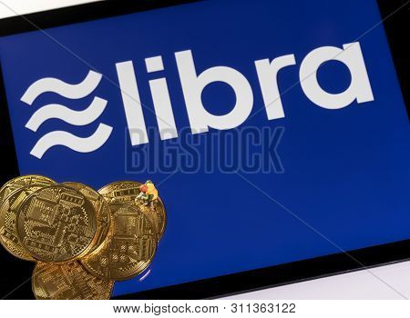 Morgantown, Wv - 14 July 2019: Golden Cybercurrency Coins On Top Of Tablet Computer As Concept For F