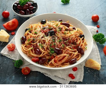Pasta Alla Puttanesca With Garlic, Olives, Capers, Tomato And Anchois Fish