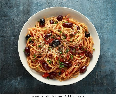 Pasta Alla Puttanesca With Garlic, Olives, Capers, Tomato And Anchois Fish