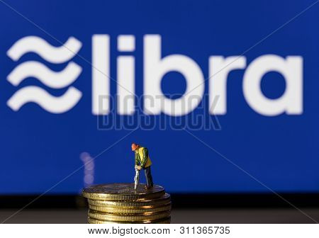 Morgantown, Wv - 14 July 2019: Golden Cybercurrency Coins On Top Of Tablet Computer As Concept For F
