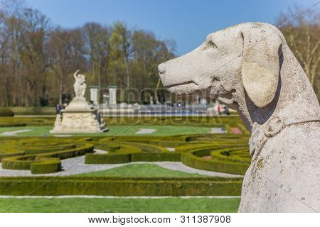 Nordkirchen, Germany - April 01, 2019: Dog Sculpture In The Garden Of Castle Nordkirchen, Germany