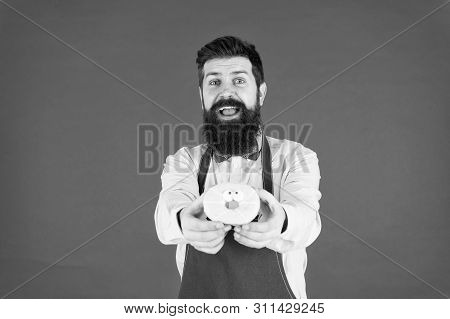 Baked With Love. Hipster Bearded Baker Hold Glazed Donut On Red Background. Cafe And Bakery Concept.