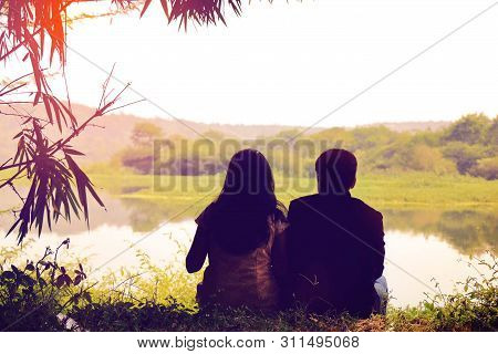 Couple Enjoying The View On Lakeside During Prewedding Photoshoot,
