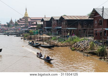 Maing Thauk, Myanmar - April 2019: Traditional Burmese Floating House On Water In Inle Lake