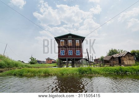 Maing Thauk, Myanmar - April 2019: Traditional Burmese Floating House On Water In Inle Lake