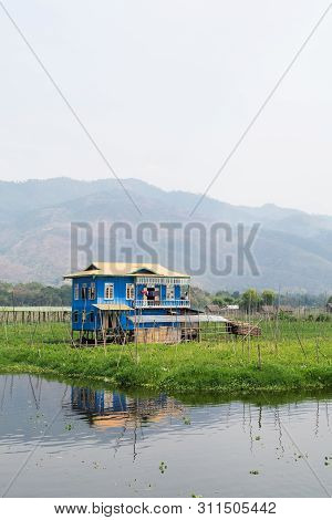 Maing Thauk, Myanmar - April 2019: Traditional Burmese Floating House On Water In Inle Lake