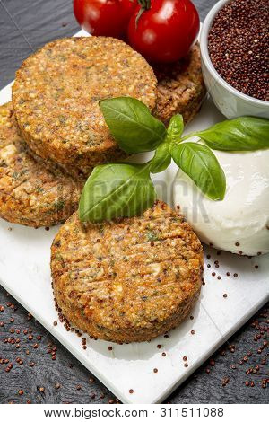 Tasty Vegetarian Burgers Made From Healthy Quinoa, Basil, Tomatoes And Mozzarella Cheese