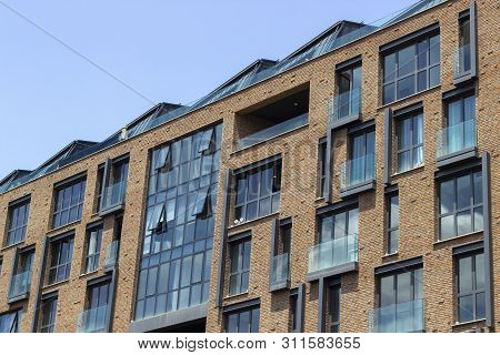 Perspective Shoot Of Brick And Open Glazing Facade Office Building