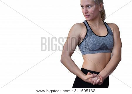 Beautiful Blonde Female Trainer Showing Her Muscles. Isolated On White Background. Healthy, Active L