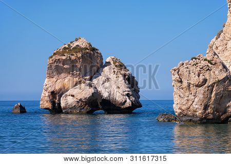 Aphrodite's Stone On Petra Tou Romiou Or Aphrodite Rock Beach, One Of The Main Attractions And Landm