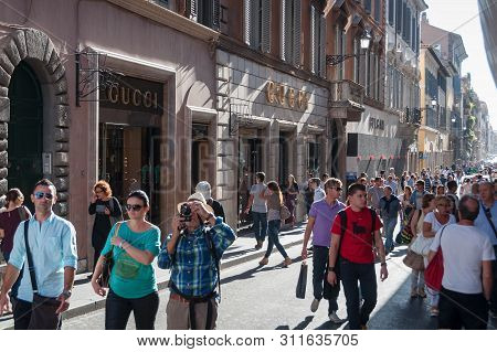 Rome, Italy - September 20, 2013: Tourists And Locals Walking The Famous Via Dei Condotti Street. Wi