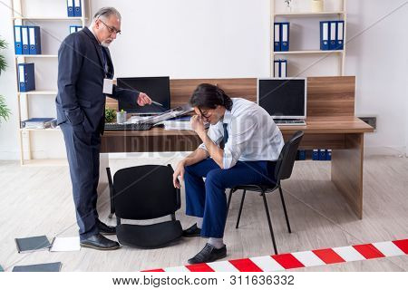 Forensic investigator investigating theft in the office