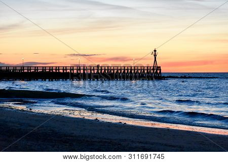 Romantic Colorful Sunset At Courseulles-sur-mer Pontoon. French Normandy