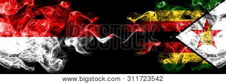 Indonesia Vs Zimbabwe, Zimbabwean Smoky Mystic Flags Placed Side By Side. Thick Colored Silky Smoke 