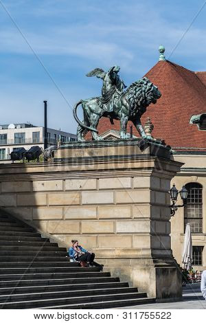 Berlin, Germany - September 23, 2018: Statue Of An Angel Riding A Lion In Front Of Konzerthaus In Be