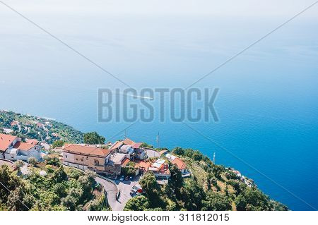 Beautiful Cozy Bay With Boats And Clear Turquoise Water In Italy