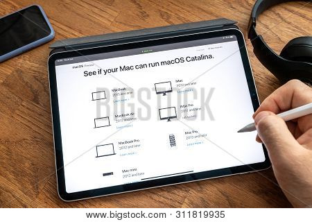 Paris, France - Jun 6, 2019: Man Reading On Apple Ipad Pro Tablet About Latest Announcement Of At Ap