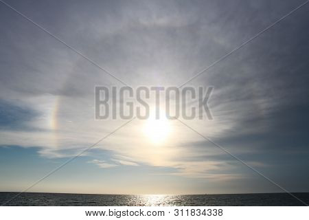 A Sundog Right Before Sunset Overlooking The Gulf Of Mexico.