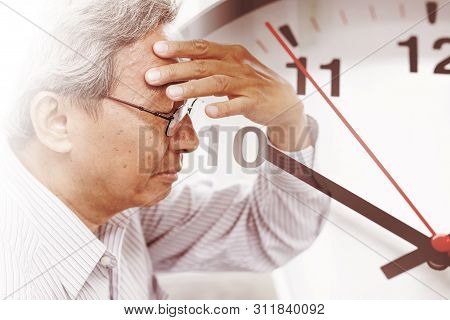 Elder Man Time Losing His Memory From Amnesia.  Brain Stroke Death Clock Countdown Concept.