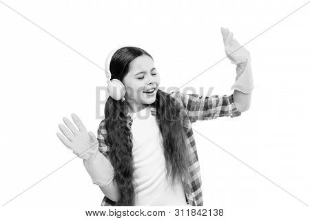 Playing Music Can Cut Cleaning Time In Half. Girl Wear Headphones And Protective Gloves For Cleaning